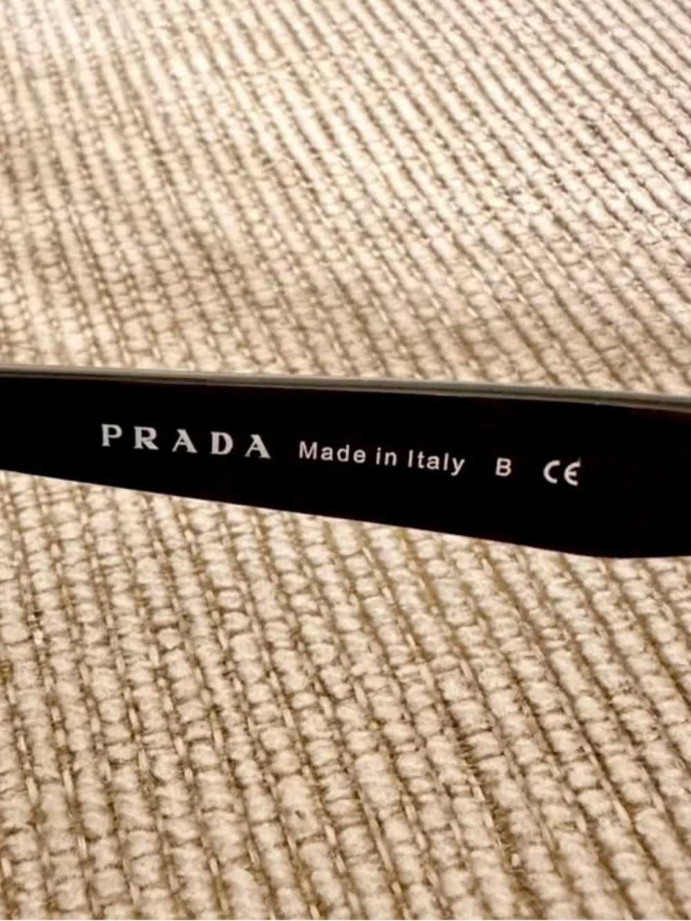 Prada Black Cat-Eye Sunglasses with Purple Crystal Trim